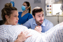 How can a birth partner support during labour and delivery?